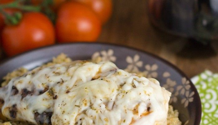 Mozzarella-covered chicken over a bed of pesto quinoa is a quick and easy dinner you'll love!
