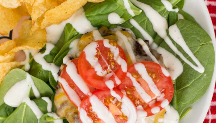 Try a juicy beef patty on a bed of baby spinach topped with melted cheese, sliced tomatoes, and Ranch dressing. Cheeseburger Ranch Salad may be your new favorite way to eat a burger!