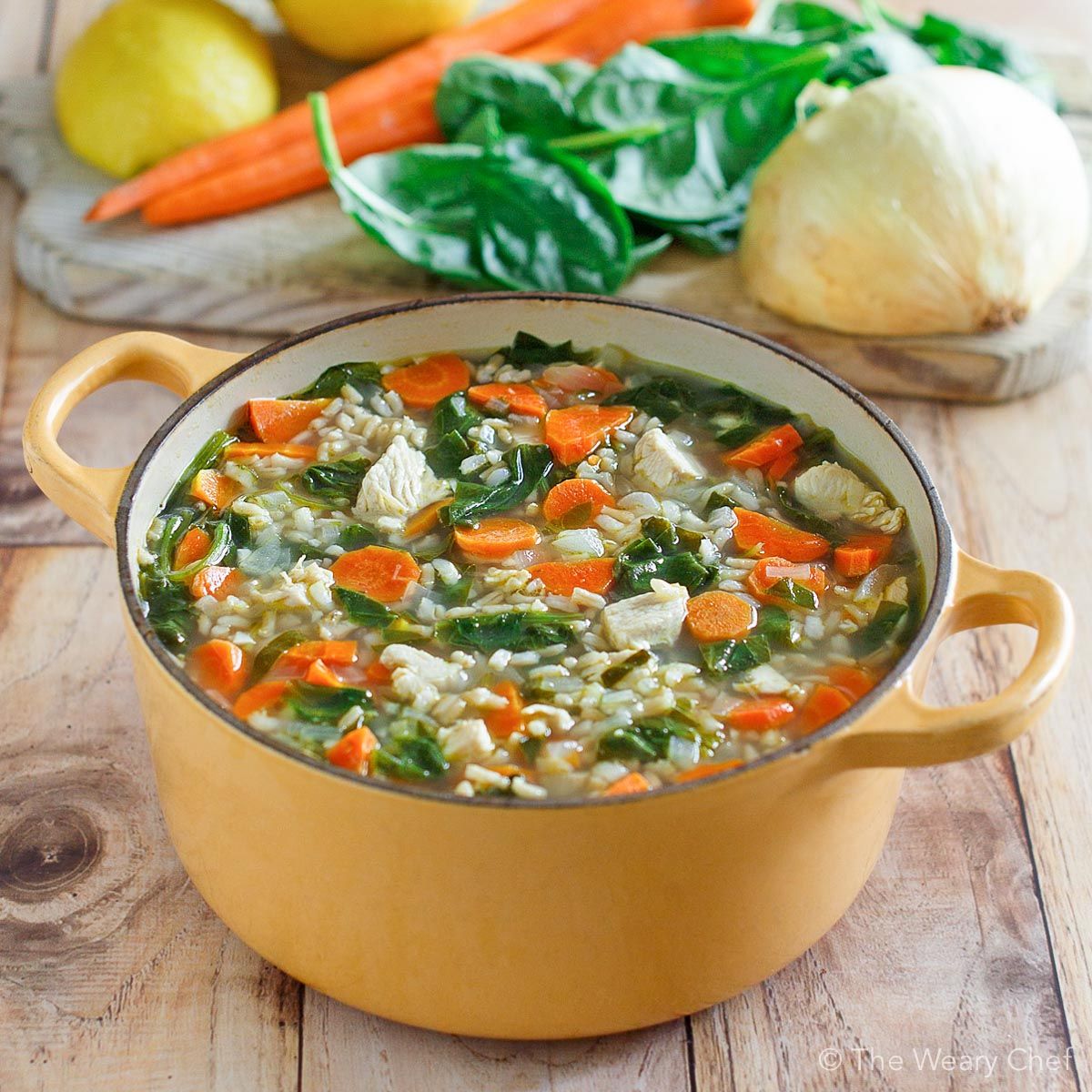 This Lemon Chicken Soup with rice and spinach is light, easy, healthy, and comforting. It will be your go-to dinner recipe on cold days! #lemon #chicken #soup