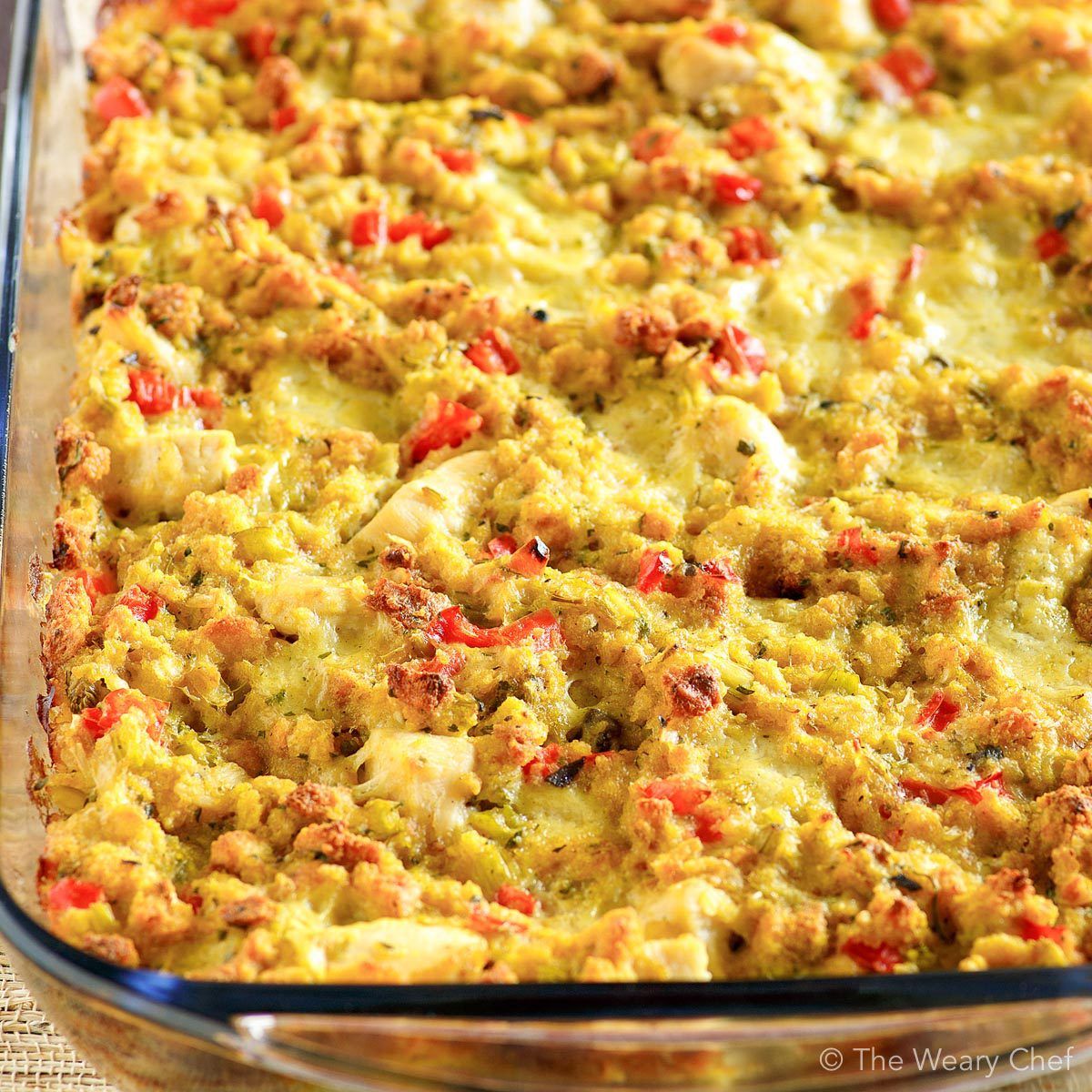 This easy, comforting Chicken and Dressing Casserole lets you enjoy the taste of the holidays any day of the year -- even on a weeknight! #casserole #thanksgiving #dressing #stuffing