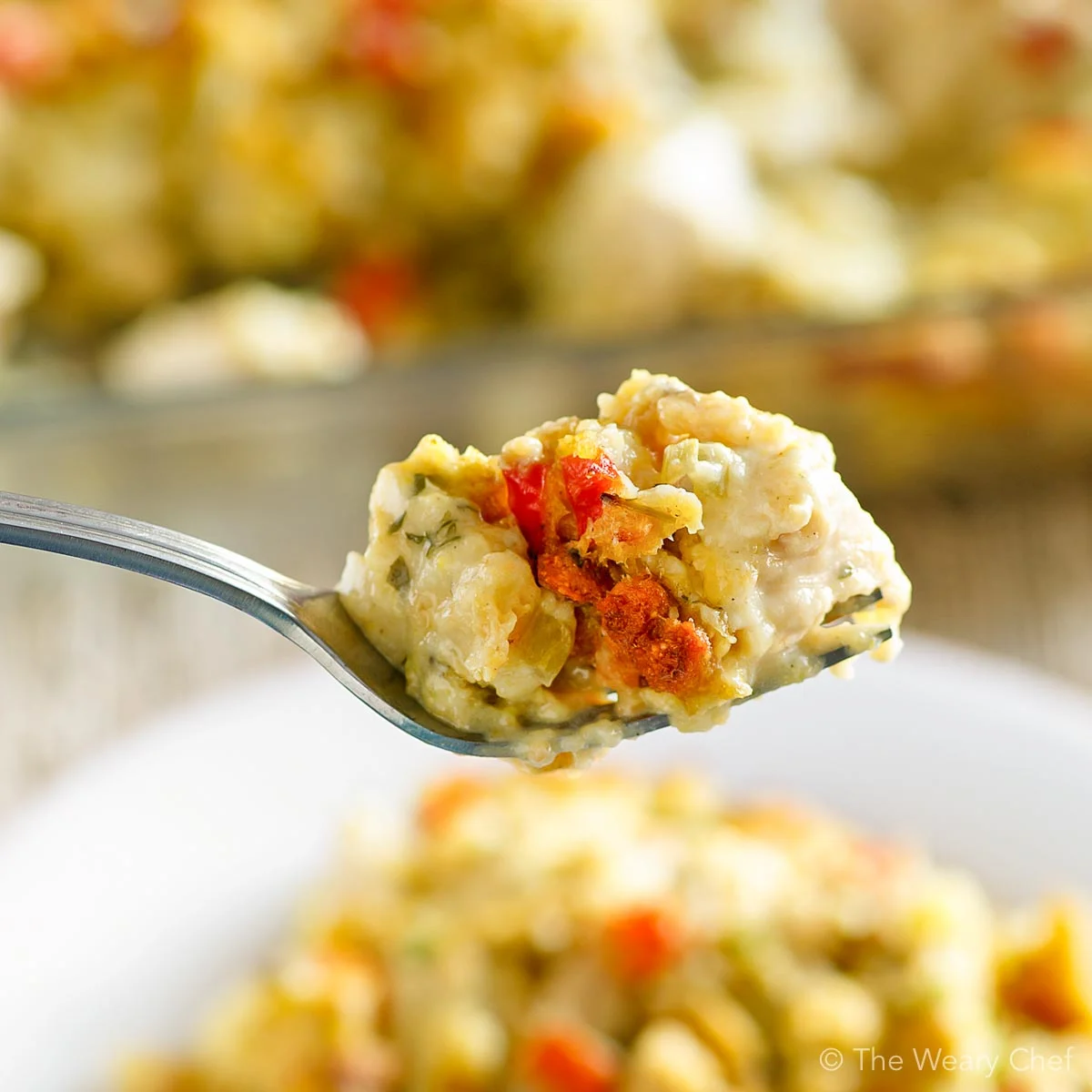 This easy, comforting Chicken and Dressing Casserole lets you enjoy the taste of the holidays any day of the year -- even on a weeknight! #casserole #thanksgiving #dressing #stuffing