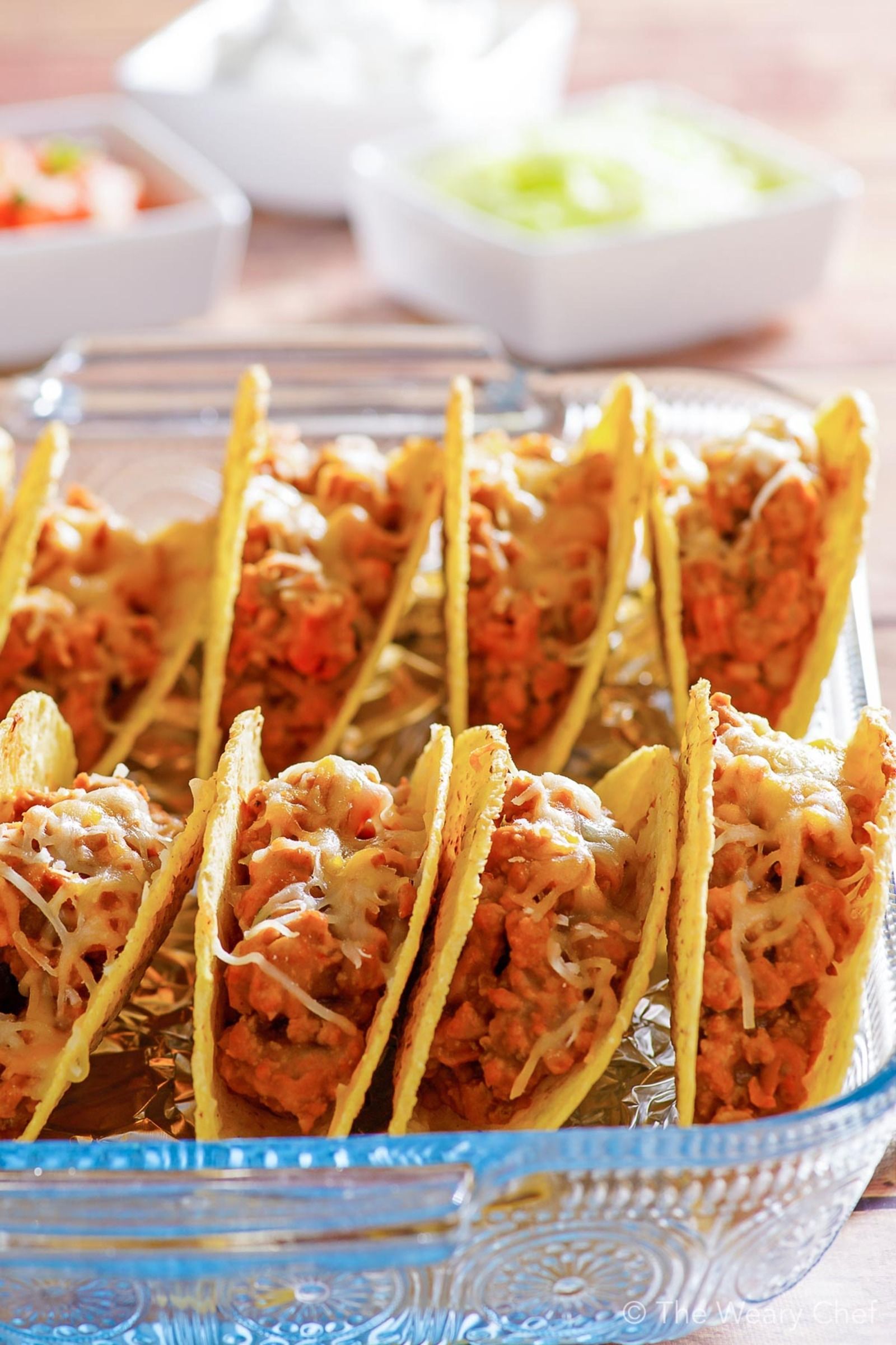 These oven baked tacos are my new favorite way to enjoy this classic dinner! Bake up a pan for your family this week, and enjoy a fun meal together. #tacos #taconight #tacotuesday #oventacos #bakedtacos