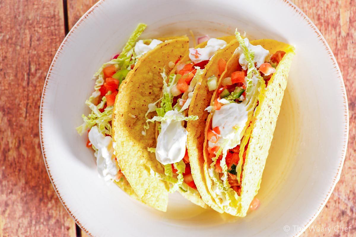 These oven baked tacos are my new favorite way to enjoy this classic dinner! Bake up a pan for your family this week, and enjoy a fun meal together. #tacos #taconight #tacotuesday #oventacos #bakedtacos