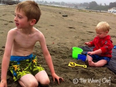 The Short One's first trip to the beach, when he wouldn't leave the blanket. Those were the days!