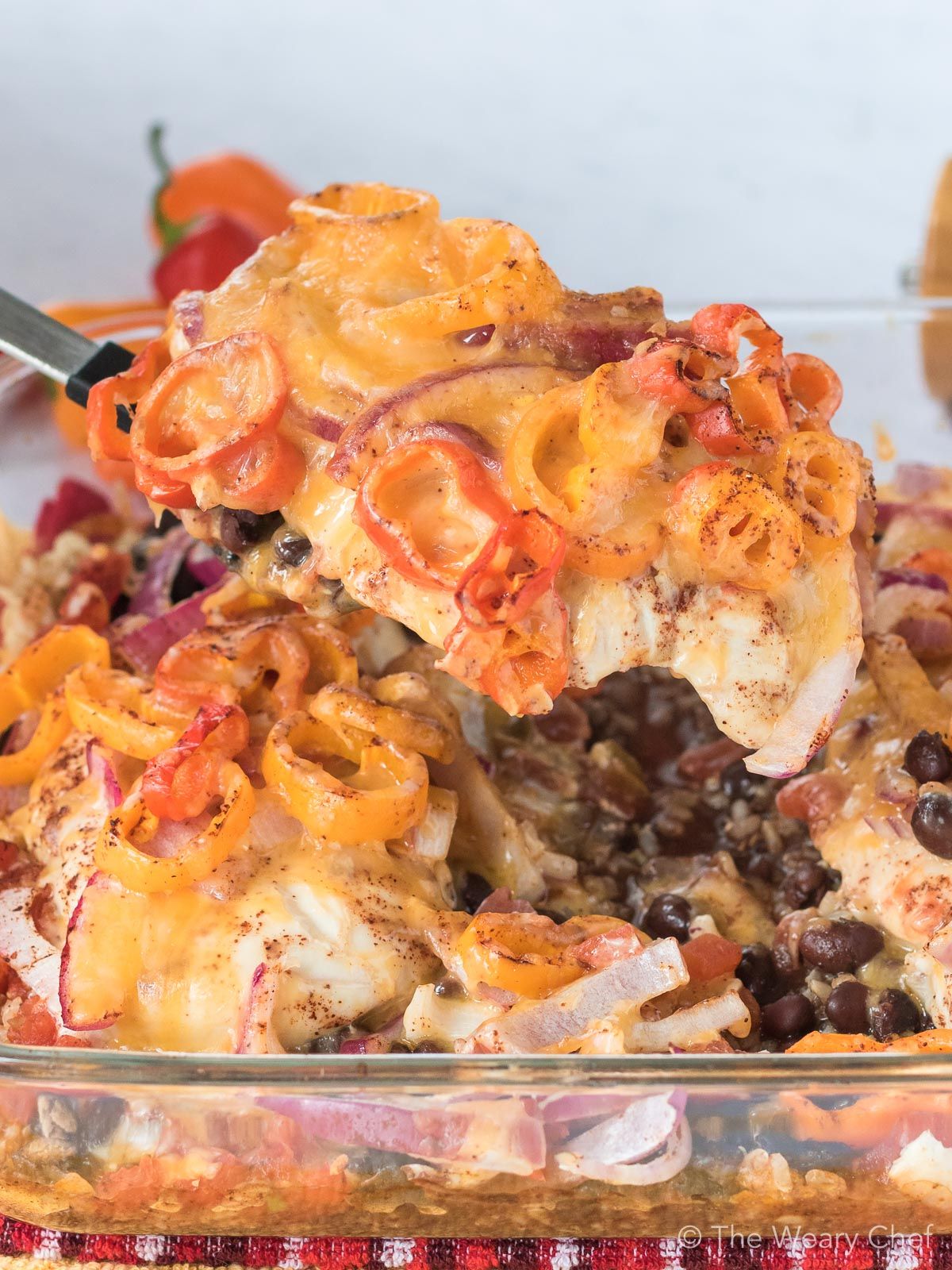 This very easy layered Southwest Chicken Casserole is an easy way to get the flavor or chicken fajitas with black beans and rice all in one pan!