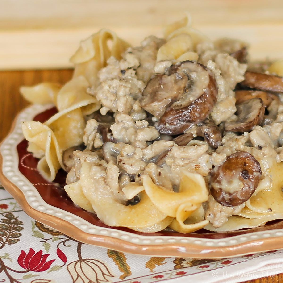 Your family will love this hearty, creamy ground beef stroganoff served over egg noodles. You will love that it's made from scratch and still ready in under 30 minutes. #stroganoff #groundbeef #easydinner #easyrecipe #thewearychef