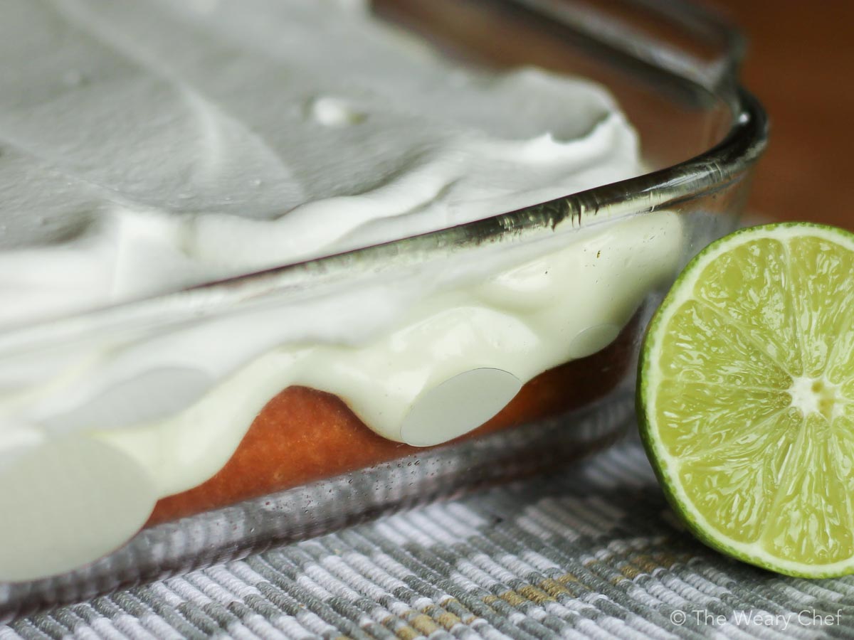 This sweet and tangy Lime Poke Cake is a perfect cake recipe for key lime pie lovers! #dessert #pokecake #lime #cake