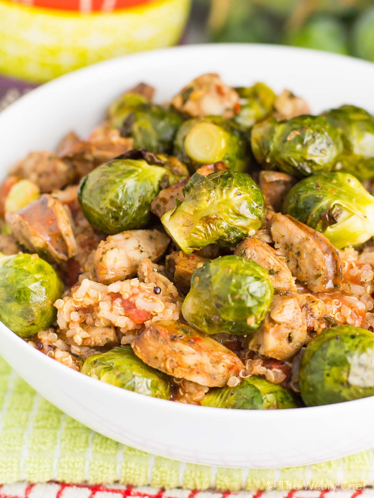 Dig into this fast, delicious, healthy quinoa recipe for dinner! It's loaded with tomatoes, sausage, and brussels sprouts to fill you up in a wholesome way.