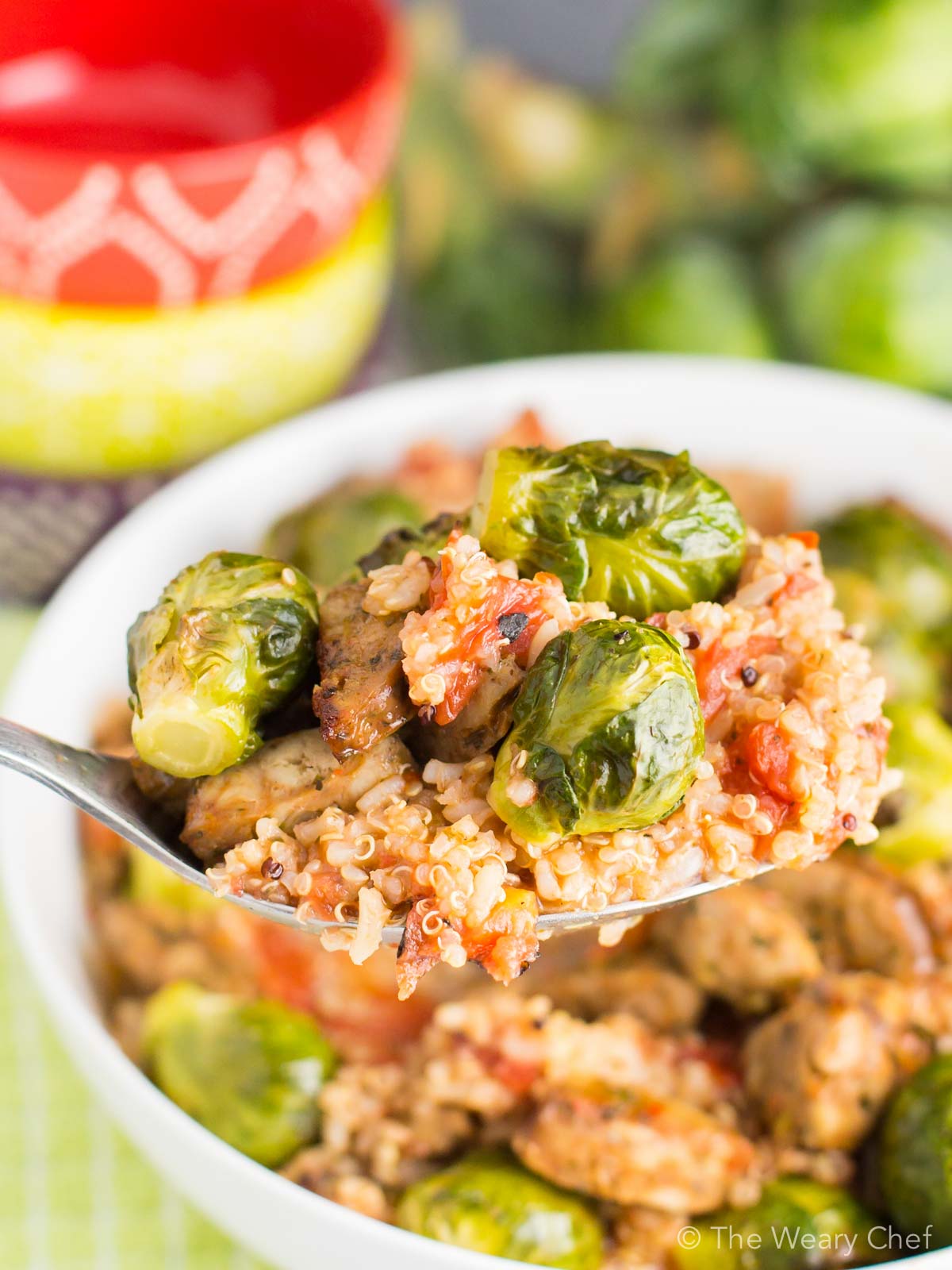 Dig into this fast, delicious, healthy quinoa recipe for dinner! It's loaded with tomatoes, sausage, and brussels sprouts to fill you up in a wholesome way.