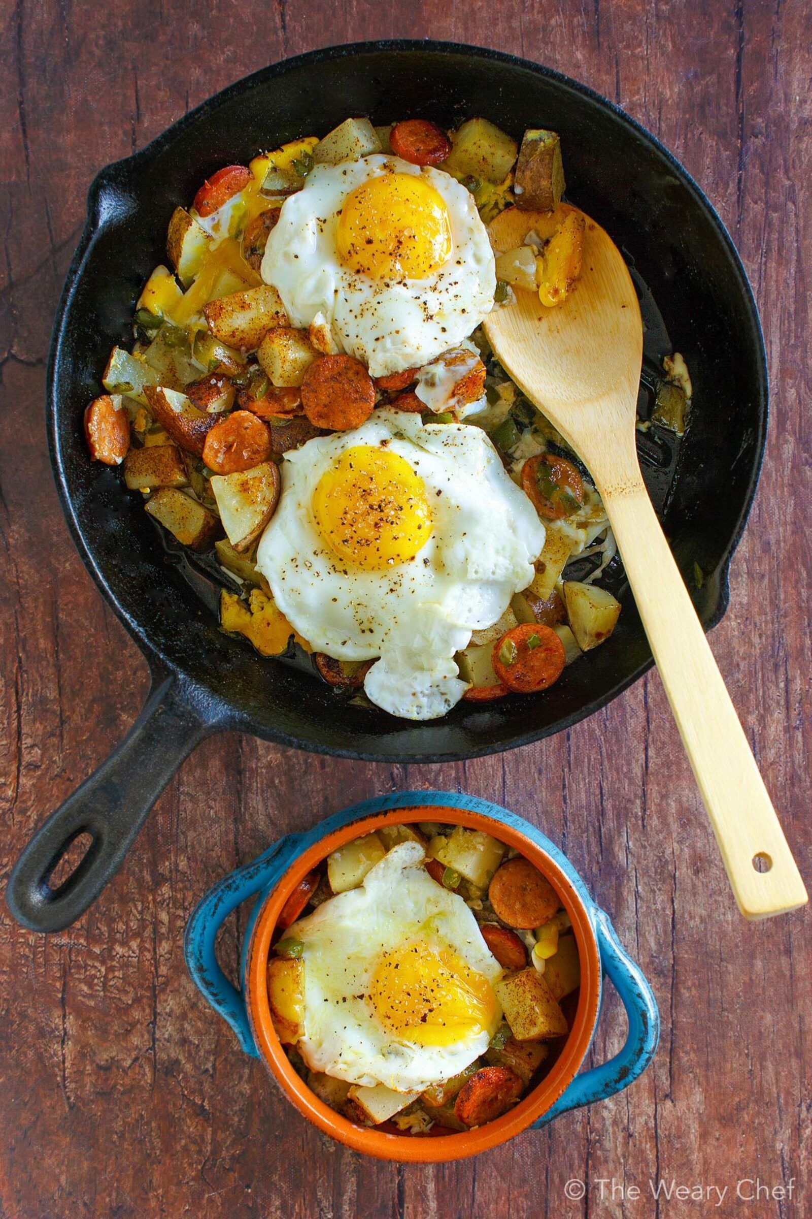 Baked Eggs over Roasted Potatoes and Sausage makes a perfect meal any time of day! #eggs #sausage #potatoes #breakfast