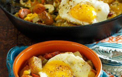 Baked Eggs over Roasted Potatoes and Sausage makes a perfect meal any time of day! #eggs #sausage #potatoes #breakfast