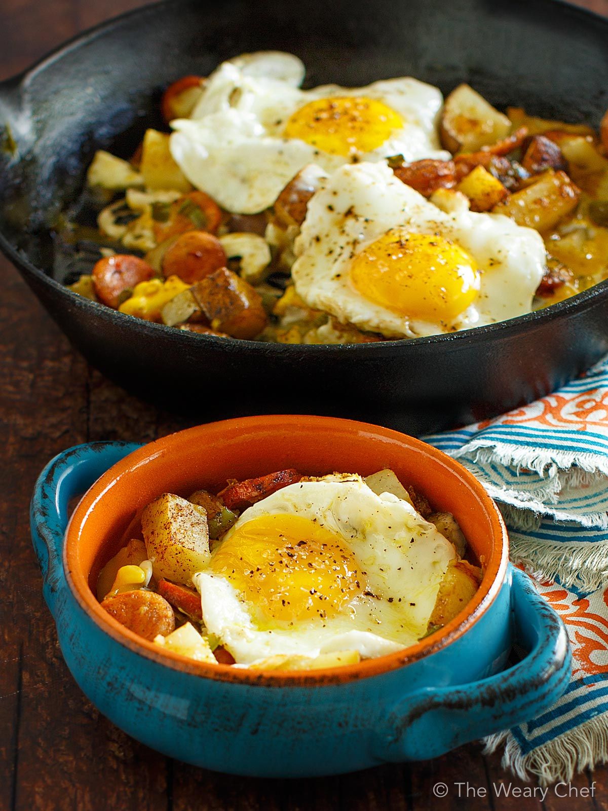 Baked Eggs over Roasted Potatoes and Sausage - The Weary Chef