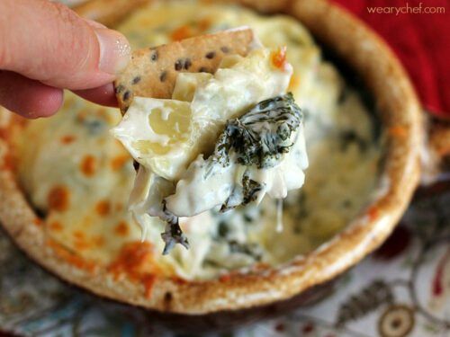 This Kale Artichoke Dip lightened up with reduced-fat ingredients is perfect for entertaining!