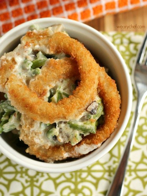 Green Bean Casserole with Onion Ring Topping - This delicious casserole is made with a homemade creamy mushroom sauce and topped with crispy onion rings for a holiday side dish to remember!