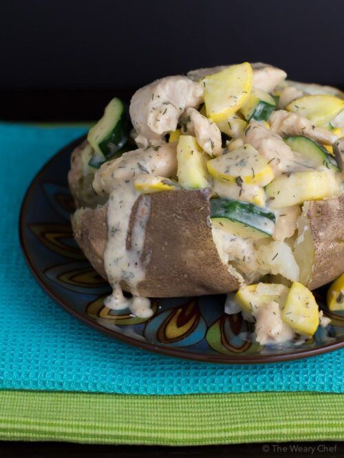 Baked potatoes smothered with chicken and vegetables in a creamy ranch sauce are a hearty, easy dinner!