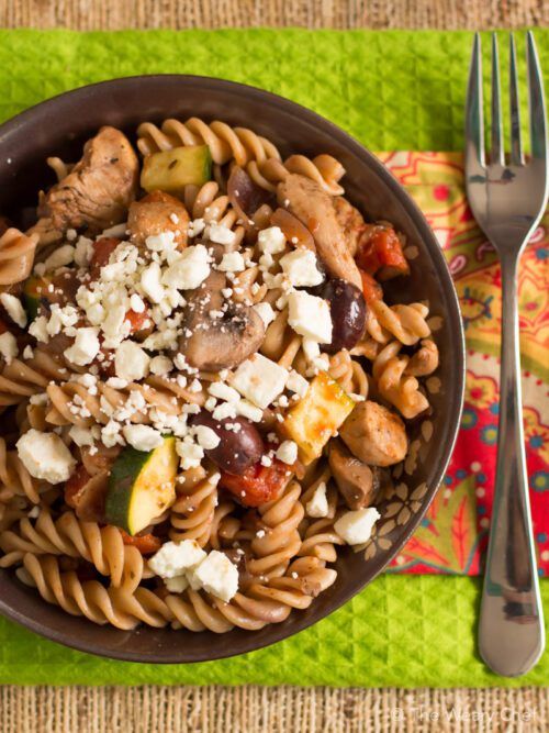 You'll love this easy pasta dinner recipe loaded with chicken, vegetables, olives, and topped with feta!