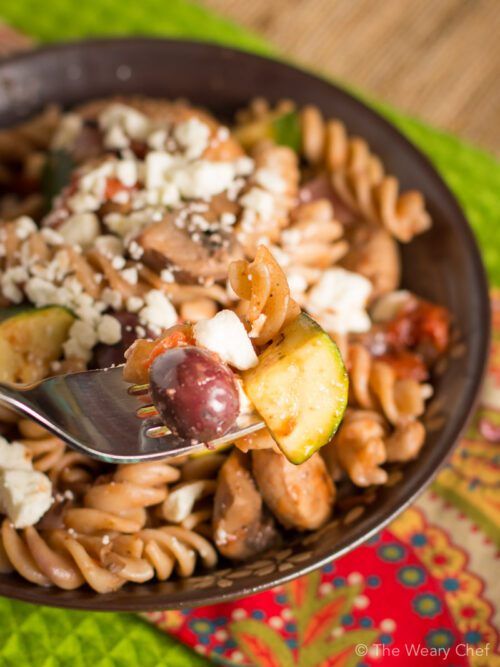 You'll love this easy pasta dinner recipe loaded with chicken, vegetables, olives, and topped with feta!