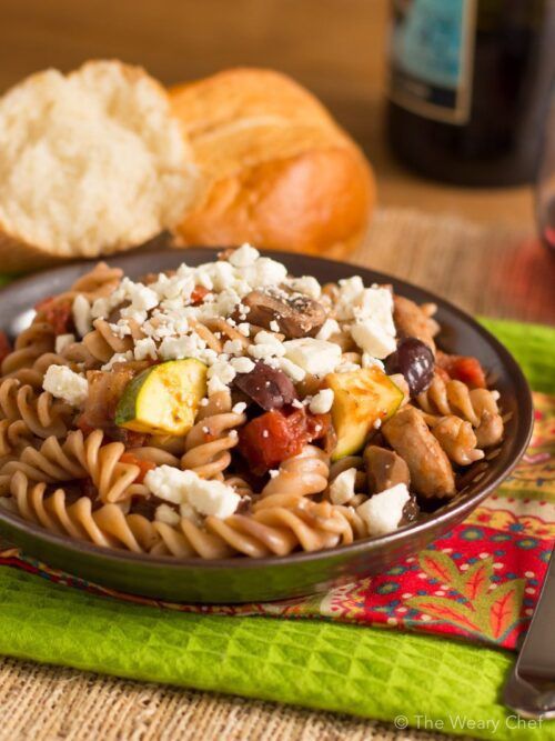 You'll love this easy pasta dinner recipe loaded with chicken, vegetables, olives, and topped with feta!