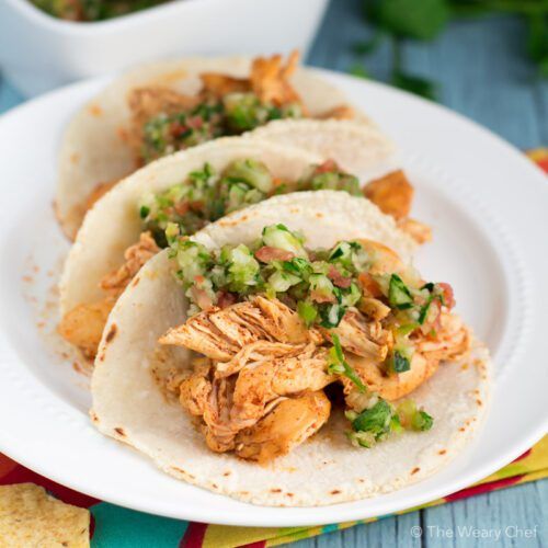 Tender margarita chicken marinated in tequila, lime juice, and spices is perfect to fill your tacos!