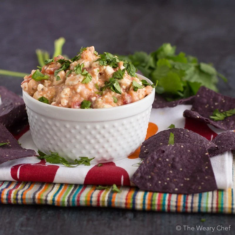 Four ingredients and five minutes is all you need for this tasty Shrimp Taco Dip!