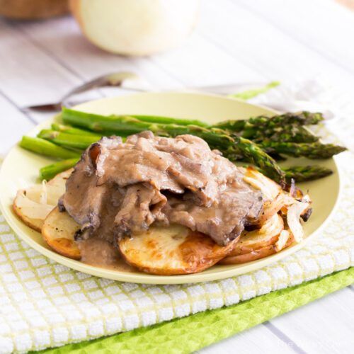 This easy recipe for roast beef and gravy served over potatoes and onions is perfect for Sunday dinner or busy weeknights!