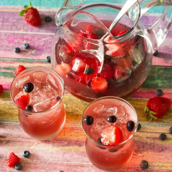 Bursting with strawberry, blueberry, and raspberry flavor, this super easy sangria is just the thing to relax with!