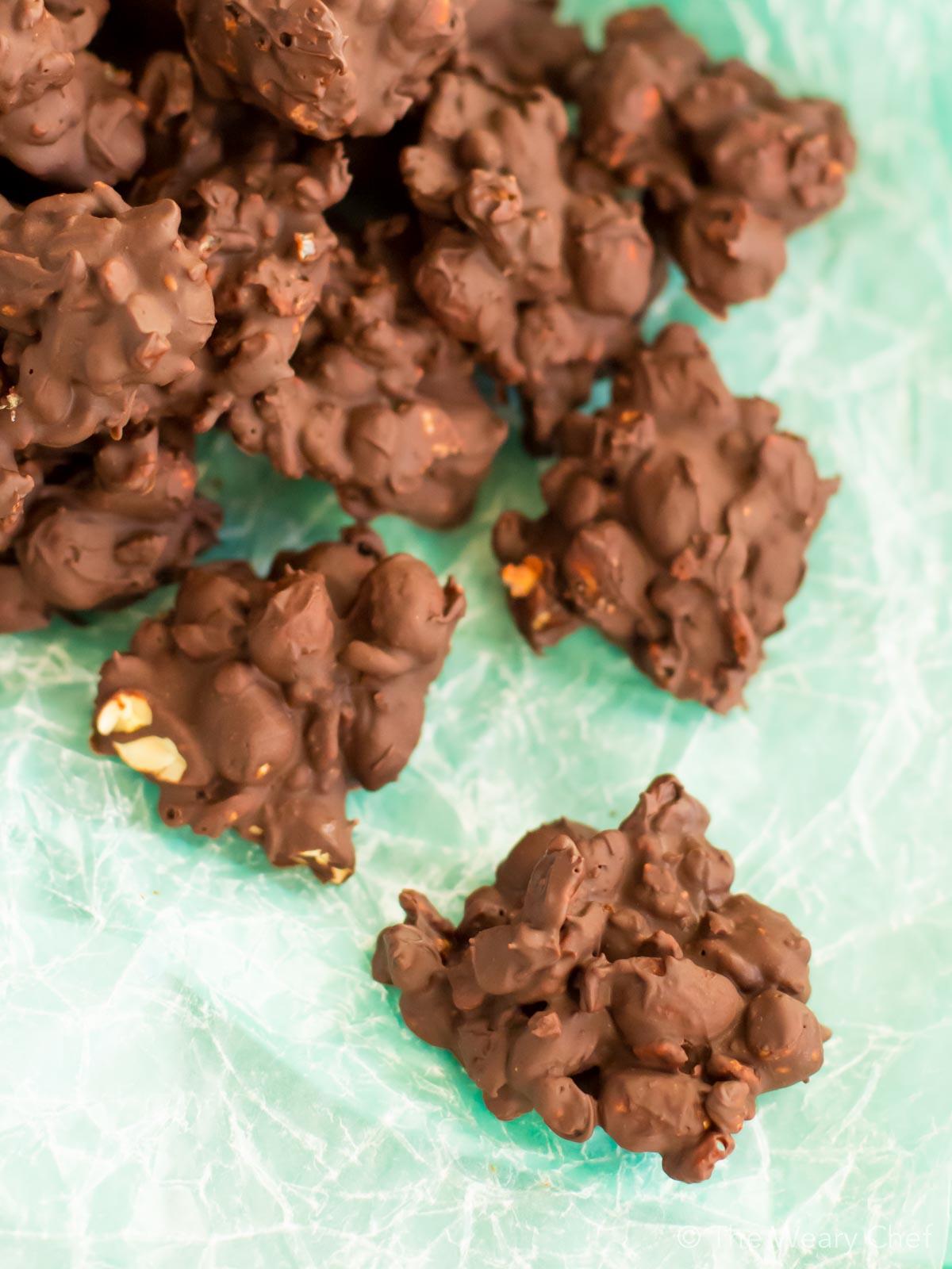 These crispy, crunchy Dark Chocolate Peanut Clusters are fun and easy to make. Perfect for holiday gifts!