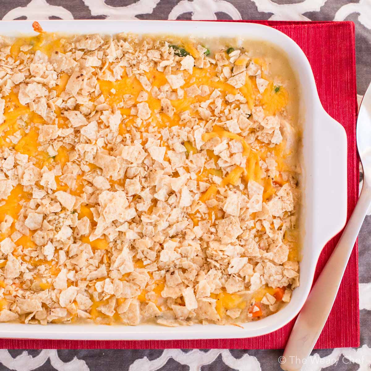 This chicken and vegetable quinoa casserole is loaded with tender chunks of chicken and cheddar cheese, then topped with crunchy tortilla chips. Such a satisfying and easy dinner recipe!