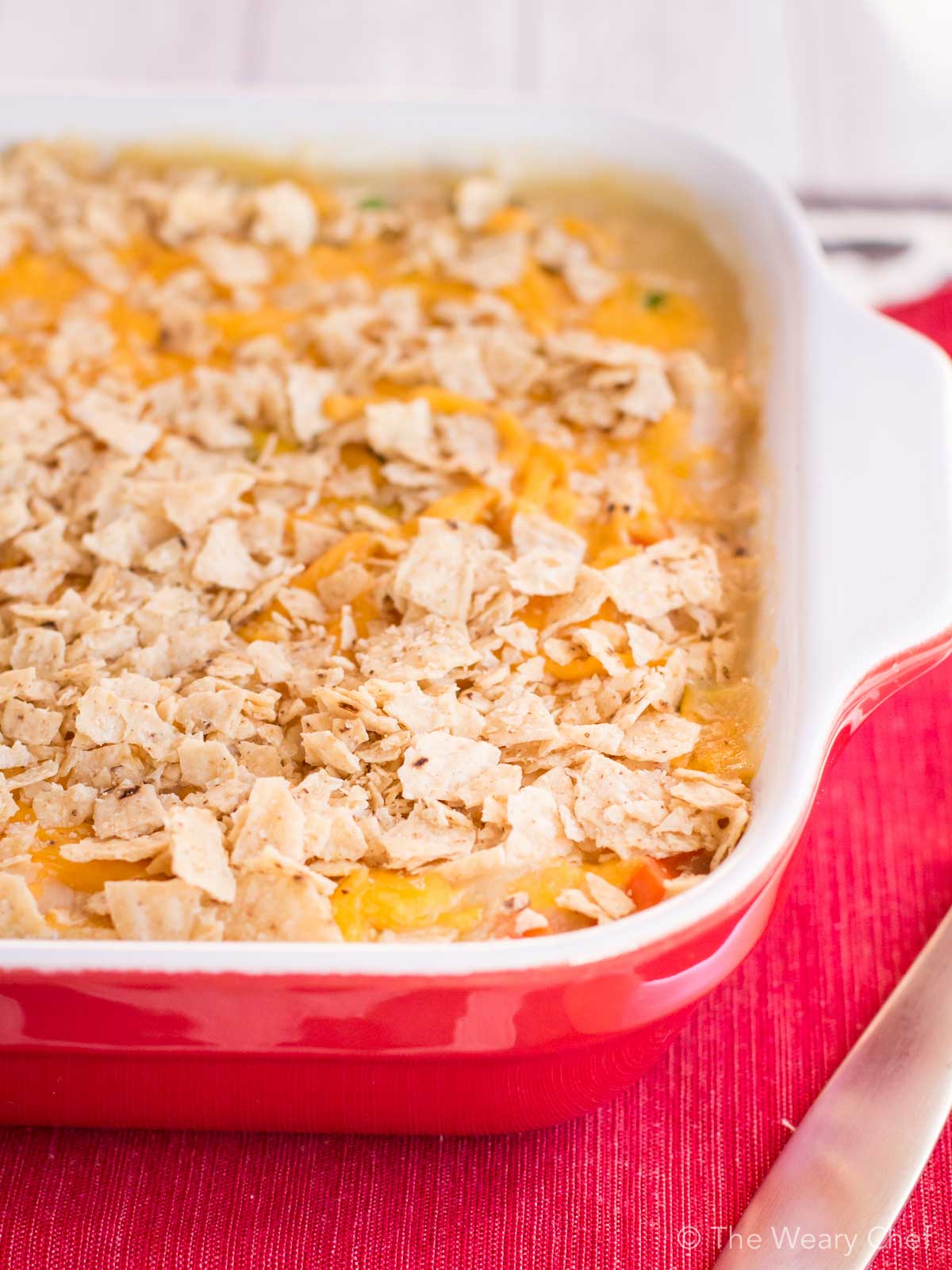 This chicken and vegetable quinoa casserole is loaded with tender chunks of chicken and cheddar cheese, then topped with crunchy tortilla chips. Such a satisfying and easy dinner recipe!