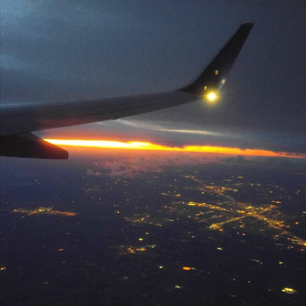 Watching the sunrise from the plane.