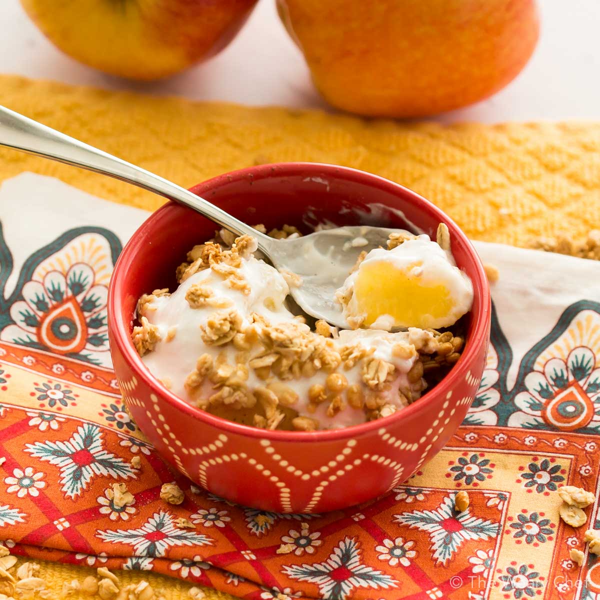 Treat yourself to a baked apple topped with creamy yogurt and crunchy granola, all ready in about five minutes with no added sugar!