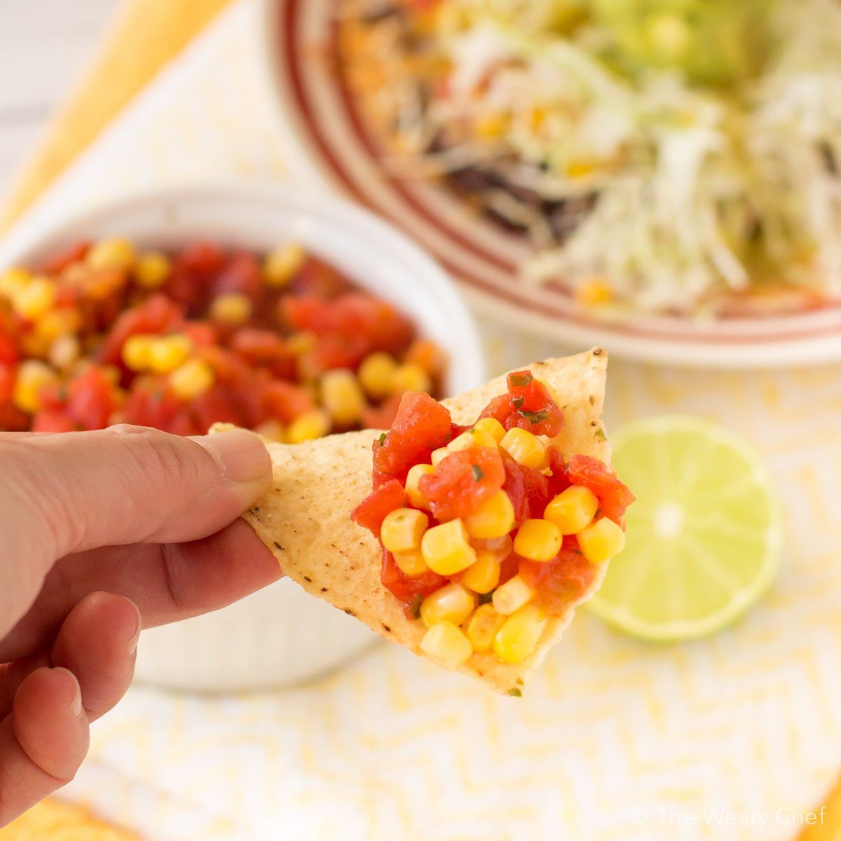 These loaded tostadas topped with easy corn salsa are on the table in about 20 minutes! Perfect quick dinner recipe!