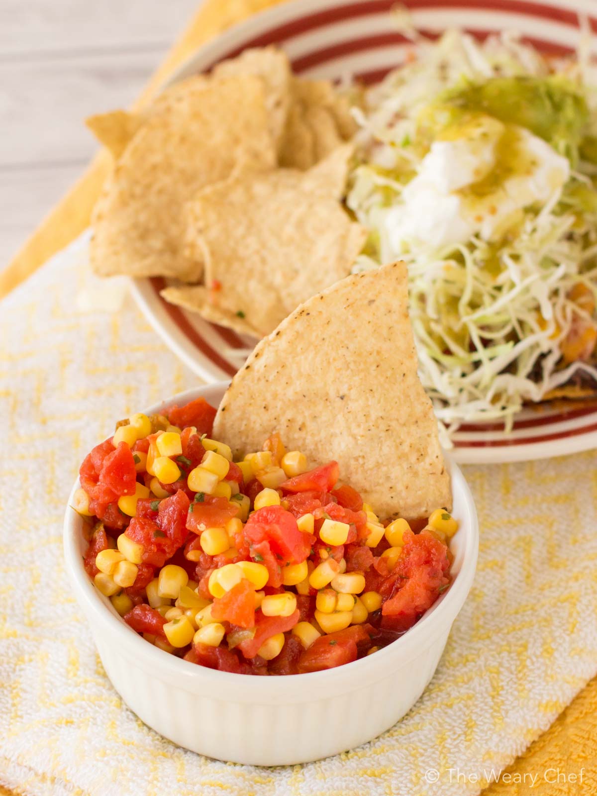 These loaded tostadas topped with easy corn salsa are on the table in about 20 minutes! Perfect quick dinner recipe!