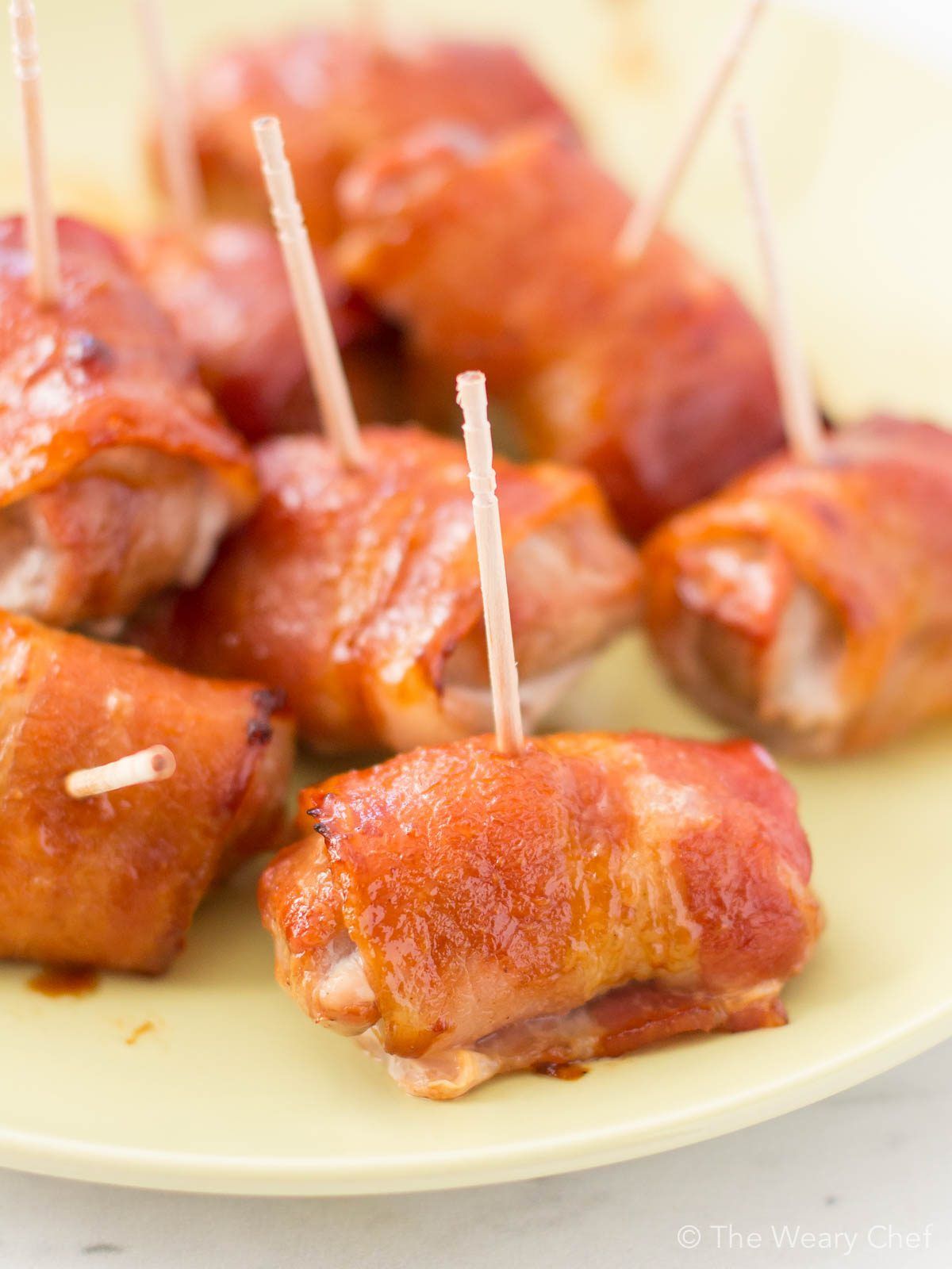 These super easy bacon-wrapped pork bites with teriyaki sauce will be the stars of any party!