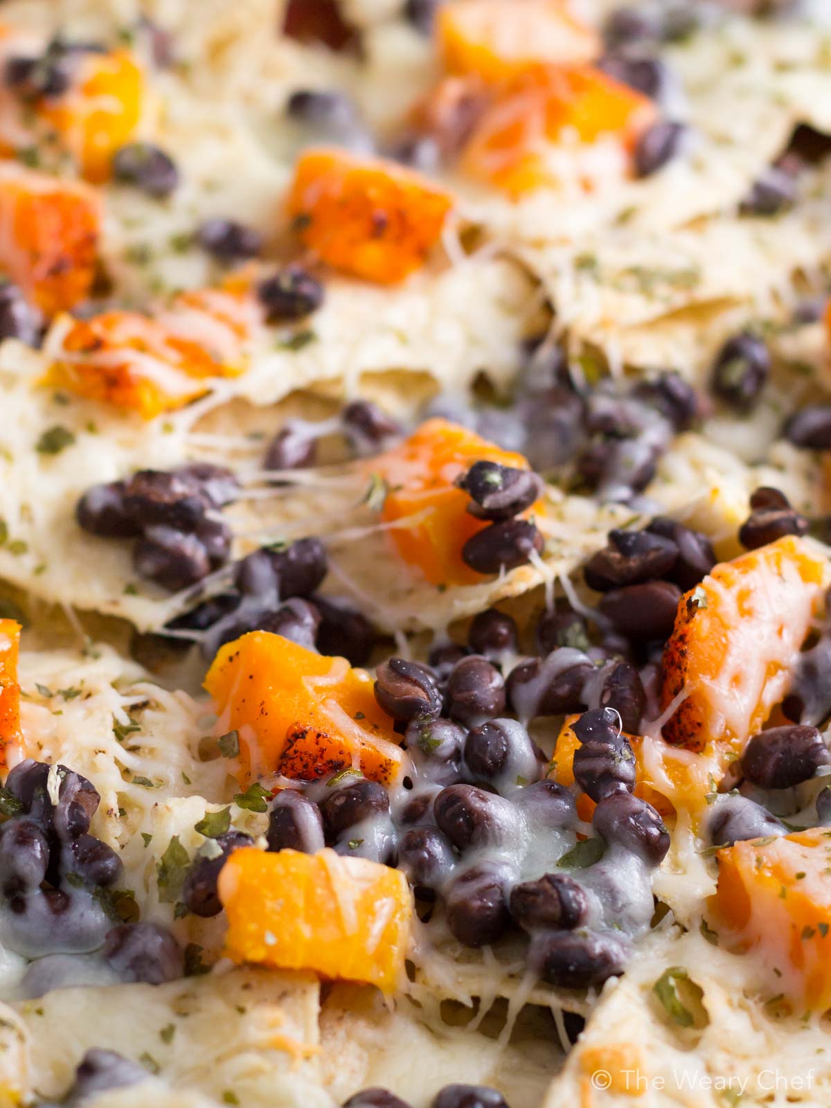 Add Fall flavor and a healthy vegetable to nacho night with these Butternut Squash and Black Bean Nachos!