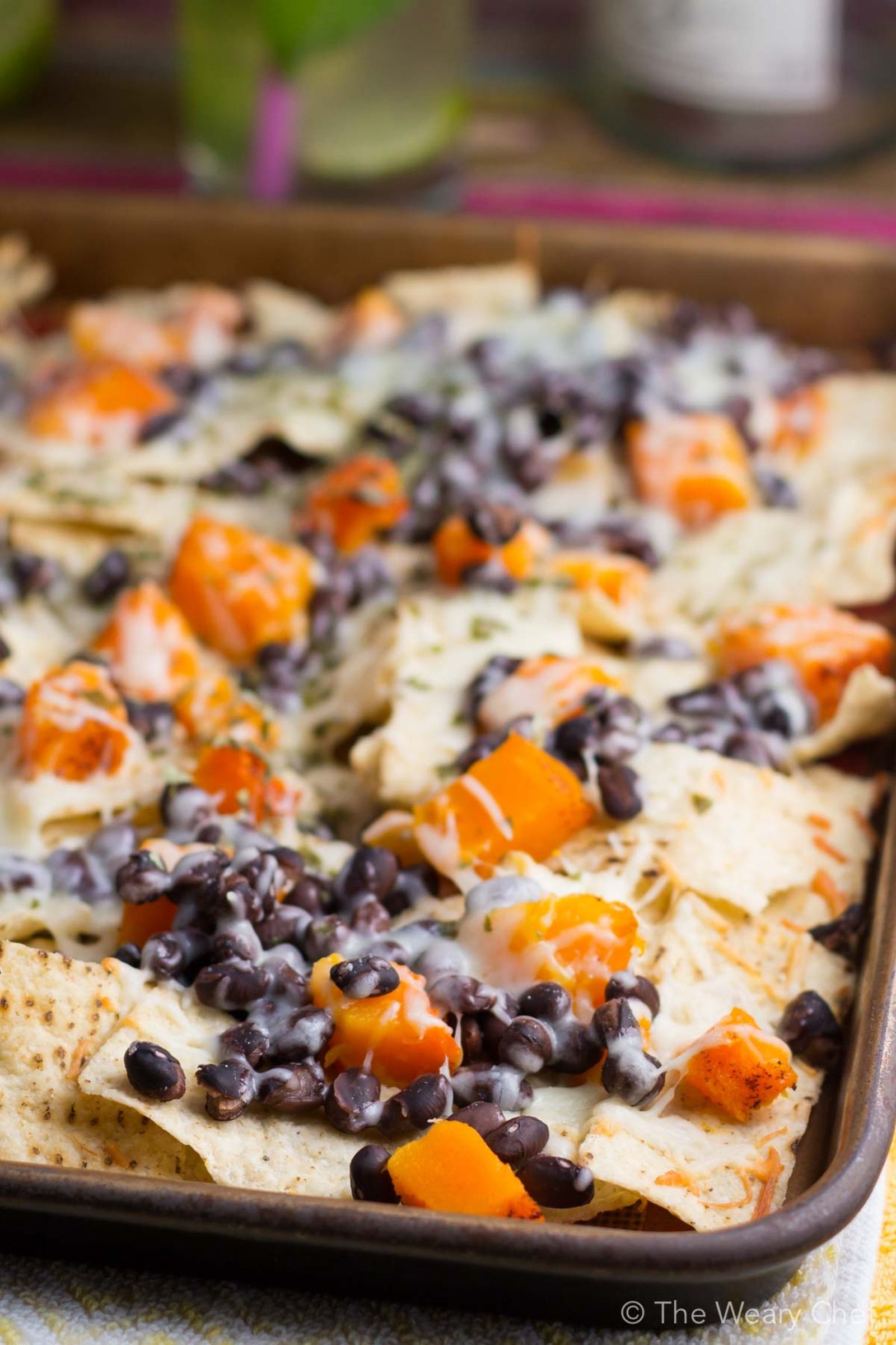 Add Fall flavor and a healthy vegetable to nacho night with these Butternut Squash and Black Bean Nachos!