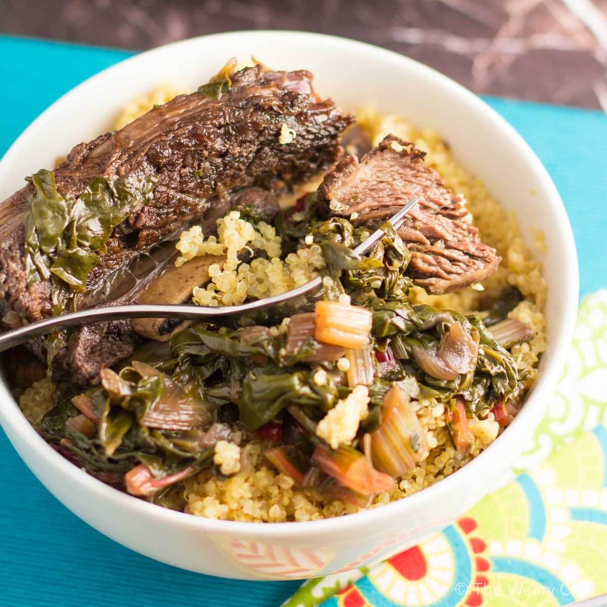 Stewing beef short ribs with chard over low heat makes for a succulent, easy dinner!