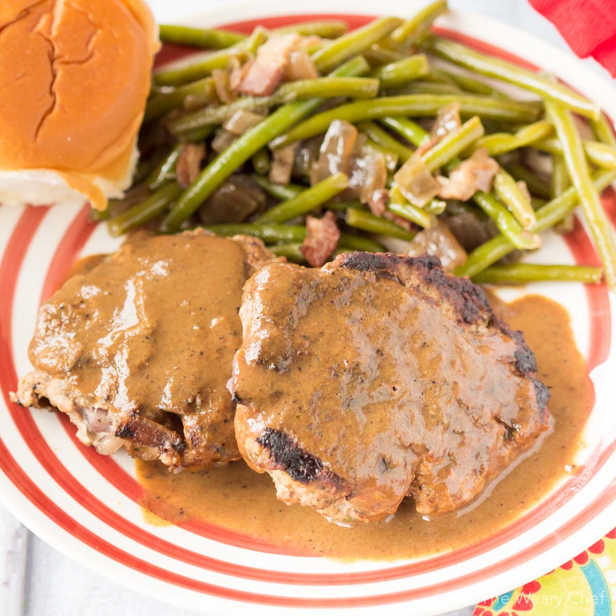 These onion burger steaks smothered in an easy brown gravy are just the ticket for a simple, comforting dinner recipe!