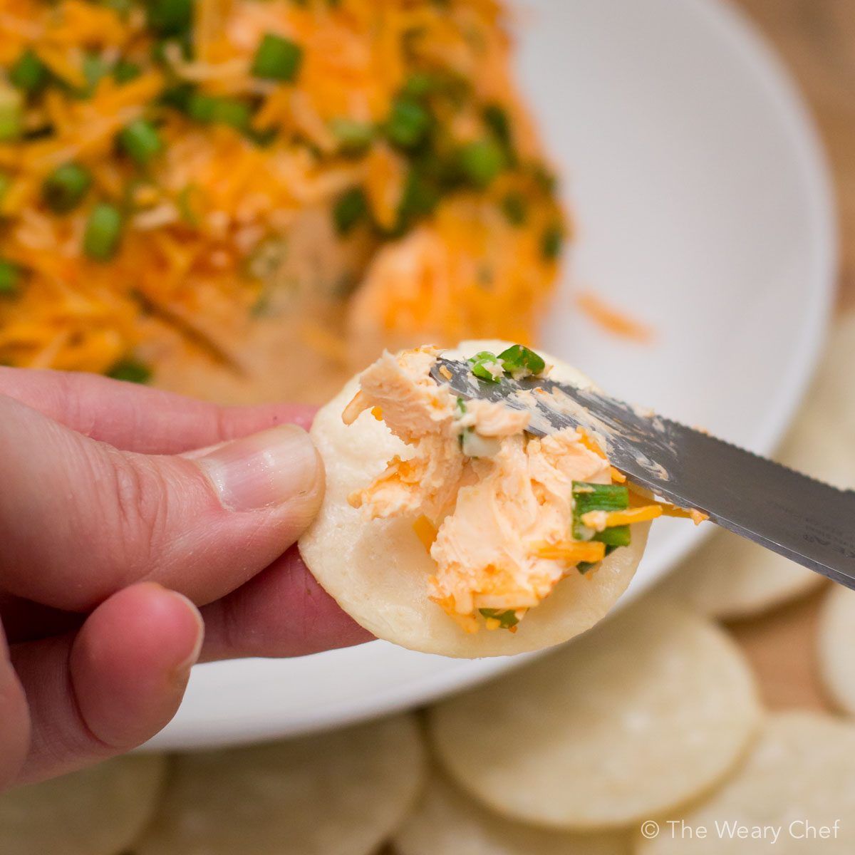 No party is complete without a cheese ball. Spice up your next gathering with this super simple Sriracha Cheddar Cheese Ball recipe. Your friends will thank you!