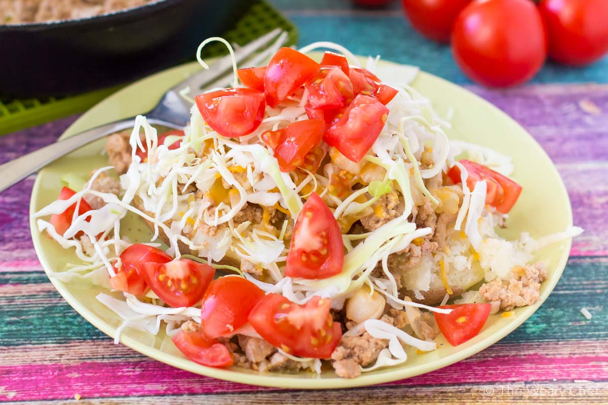 You are going to LOVE these quick and easy cheeseburger stuffed baked potatoes! Enjoy the flavor of cheeseburger and fries in one gluten-free dish!