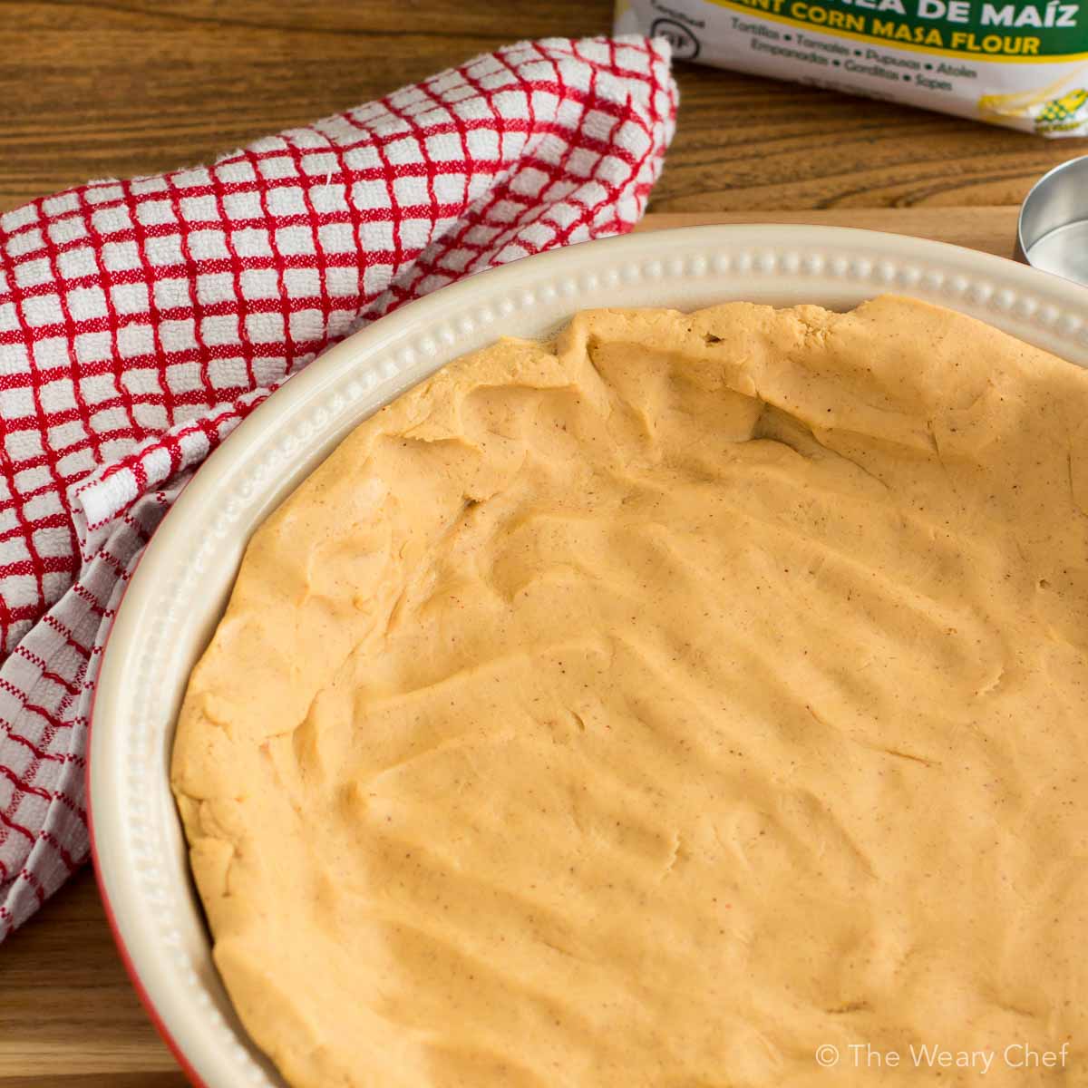 Are you ready for a stick-to-your-ribs Mexican dinner? This Chicken Tamale Pie Recipe is IT! It's gluten free, uses no lard, and is loaded with protein for a satisfying meal.