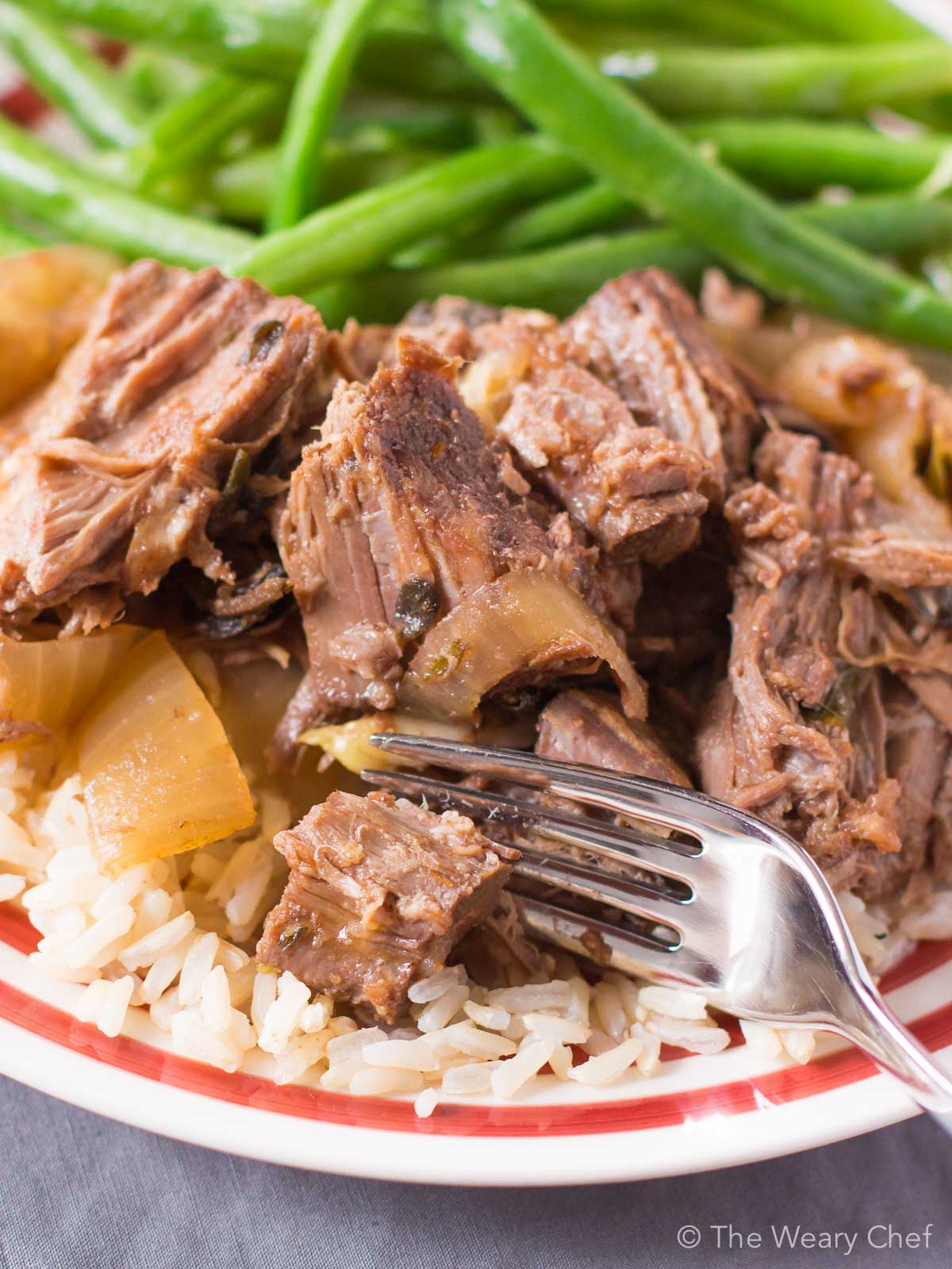 This slow cooker pot roast is LOADED with garlic and onion flavor!