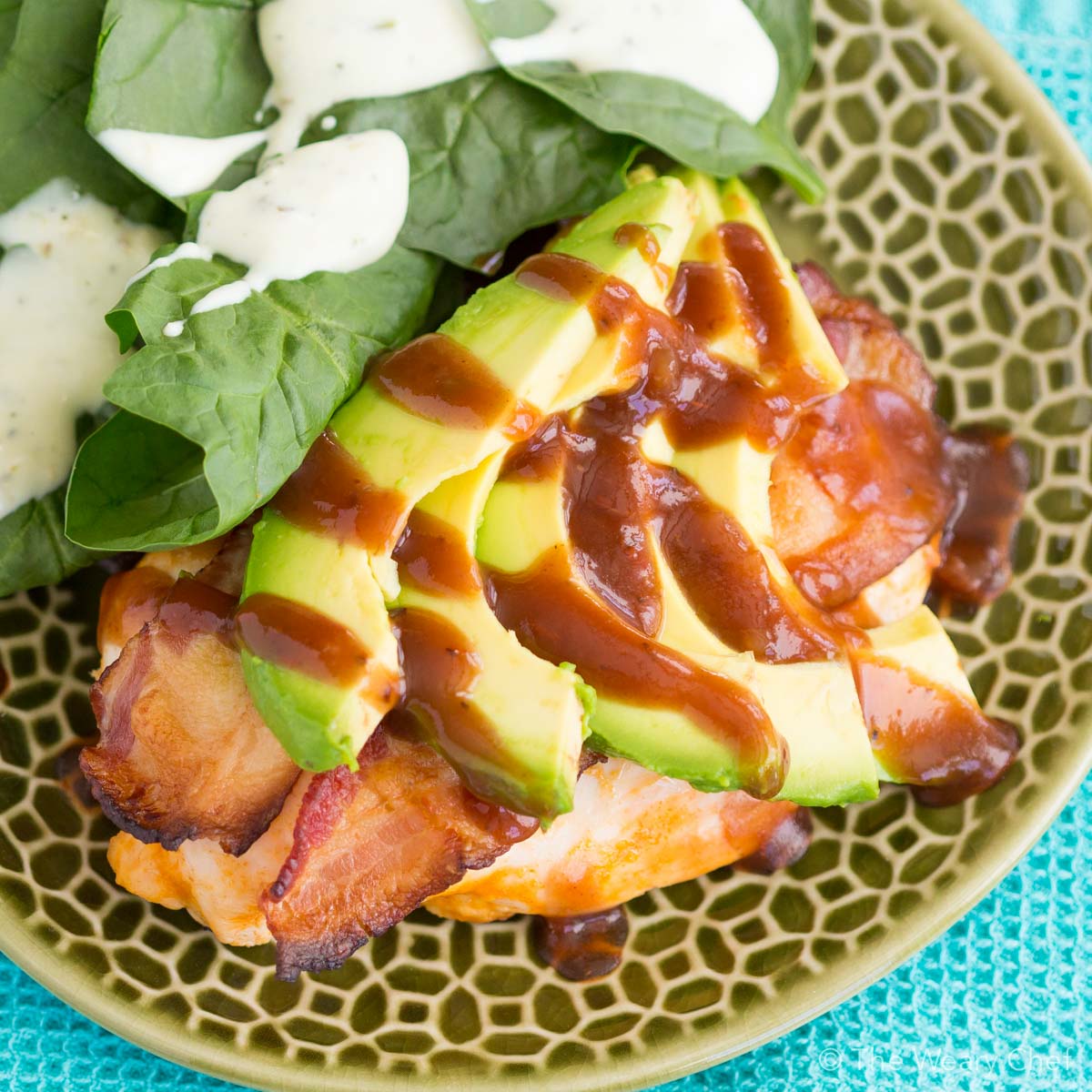 Bacon wrapped chicken seasoned with Buffalo sauce is topped with avocado slices and drizzled with tangy BBQ sauce. You can't beat this easy chicken recipe for a quick and satisfying dinner!