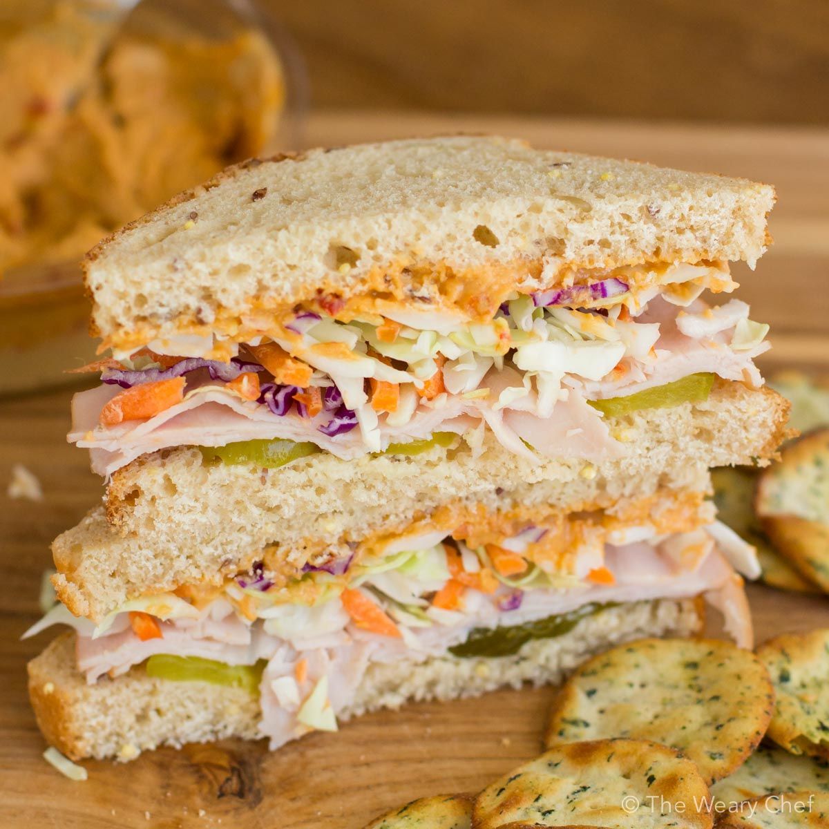 You'll love this easy sandwich for lunch. It features turkey, hummus, pickles, and cabbage for lots of flavor and crunch!