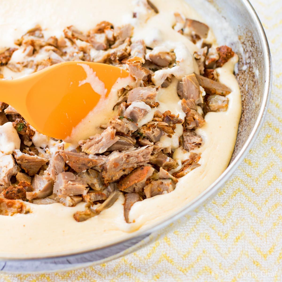 Spicy pork rib meat is stirred into a creamy cheese sauce for perfect mac and cheese!