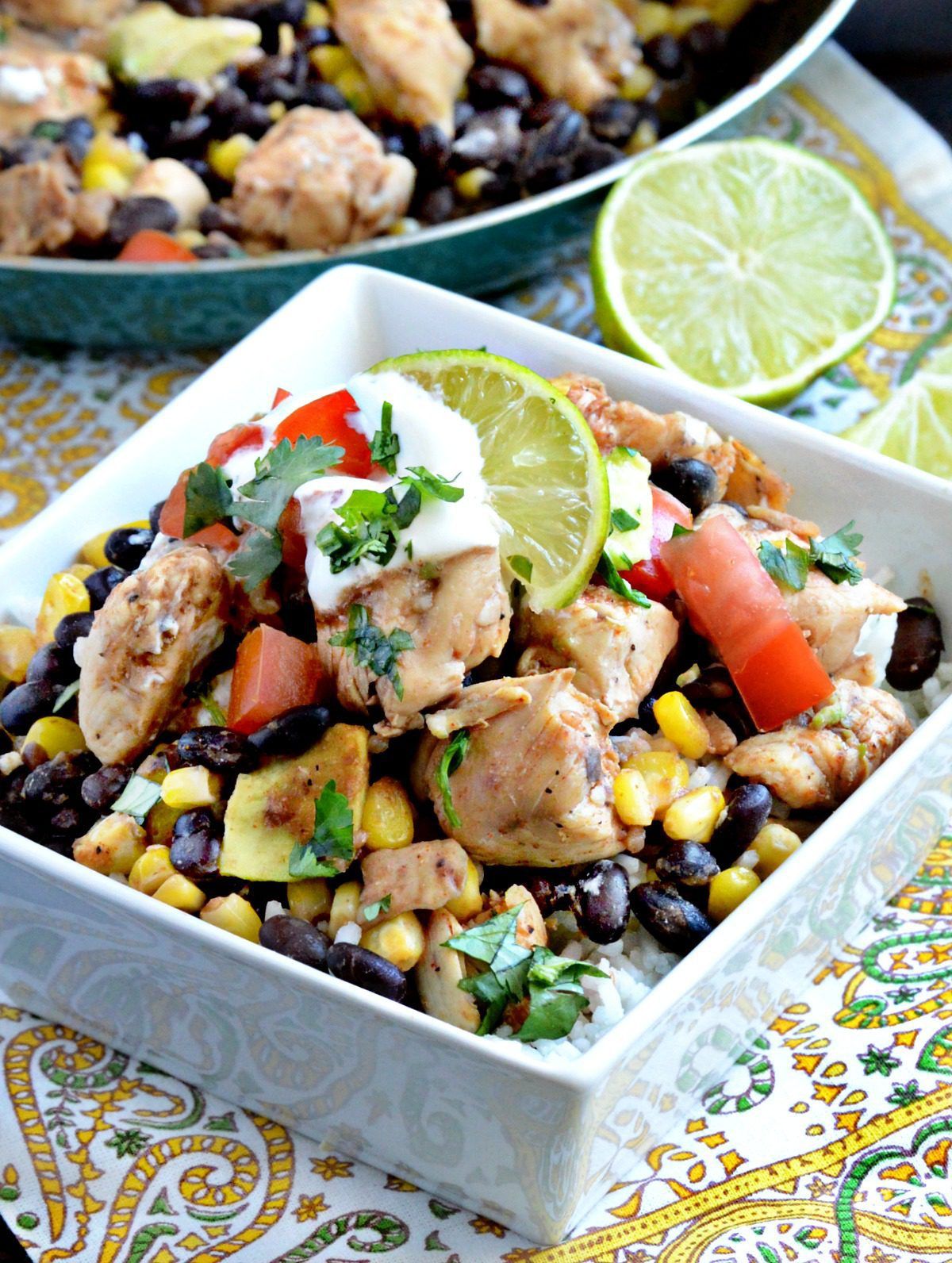 salad bowl with beans, avocado, tomato and sour cream