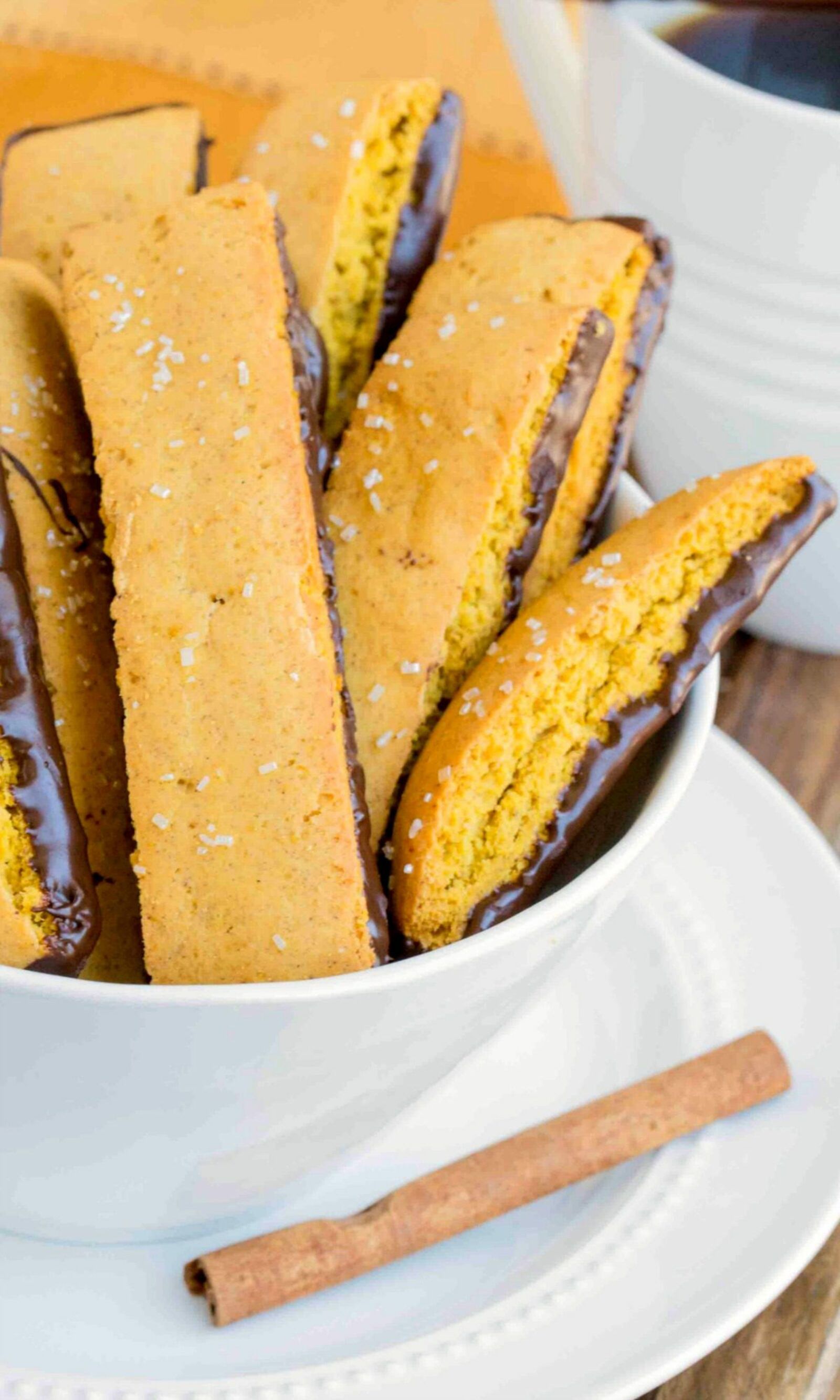 This homemade pumpkin biscotti dipped in dark chocolate is a perfect companion to your cup of coffee or tea.