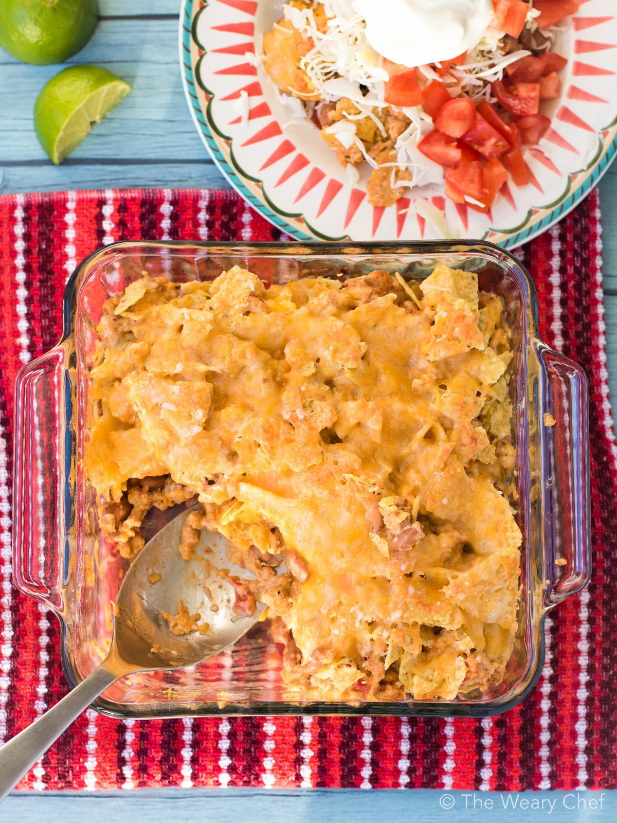 You'll love this easy Cheesy Nacho Casserole! It's loaded with ground turkey, beans, tortilla chips, and plenty of cheese for a family friendly dinner recipe!