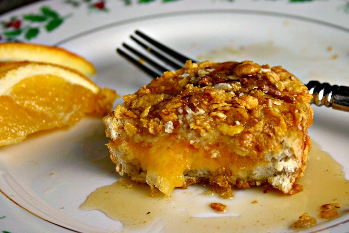 Cheese-stuffed french bread is dredged in egg and coated with cornflakes and pecans for a savory french toast to remember!