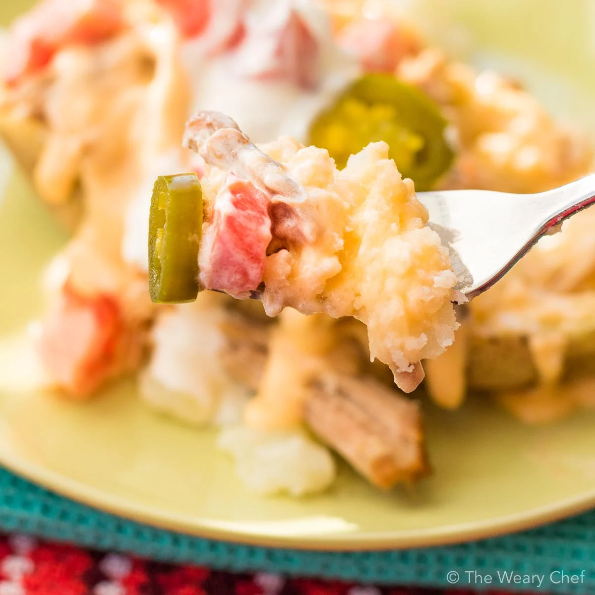 Queso Carnitas Loaded Potatoes are the best thing to happen to your dinner table in a while!